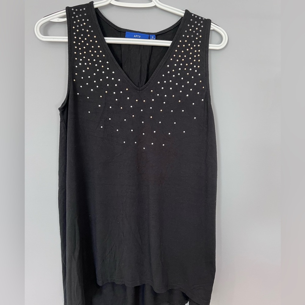 Women’s black tank with silver and gold accents